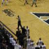 Tu Holloway and Chris Mack as Tu walks off court on Senior Night